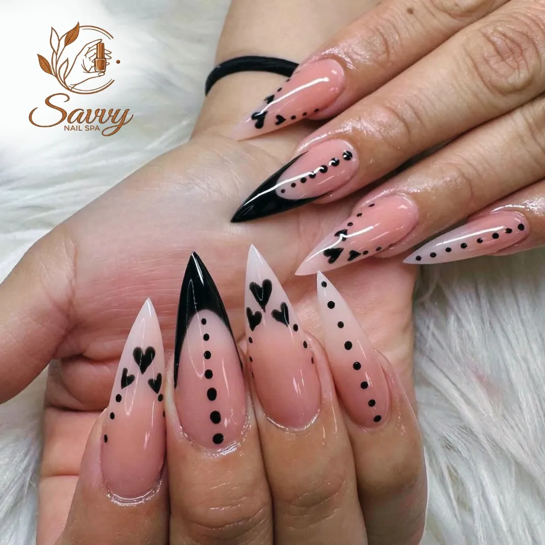 Nude-pink stilettos with black hearts and dotted details