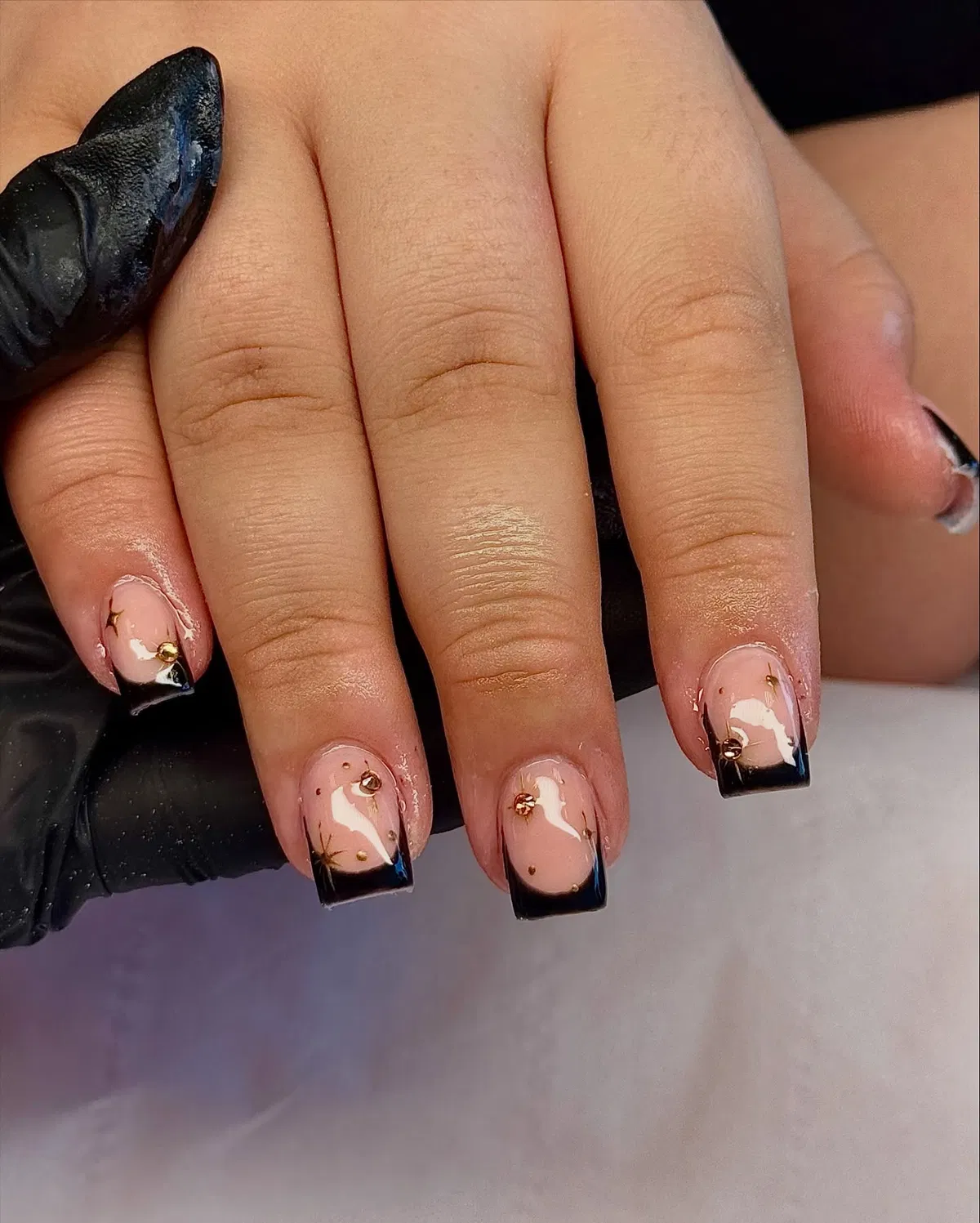 Square black tips with stud accents and fine line details