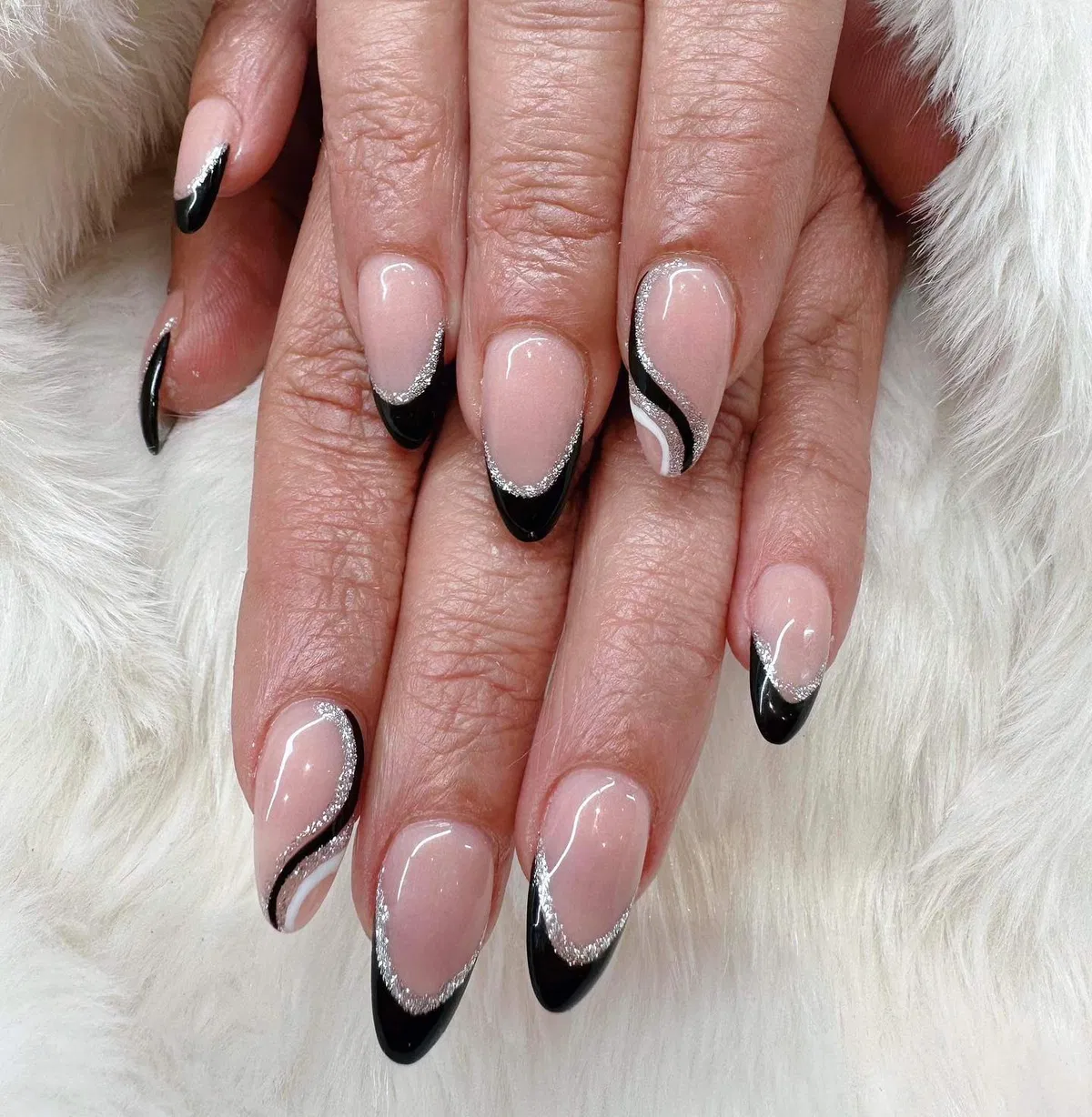 Black tips with silver glitter edging and wavy stripe accents