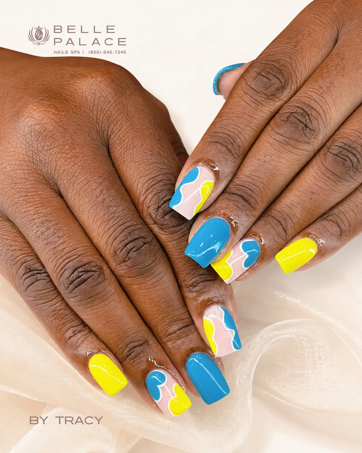 Abstract wavy accents with solid blue/yellow nails