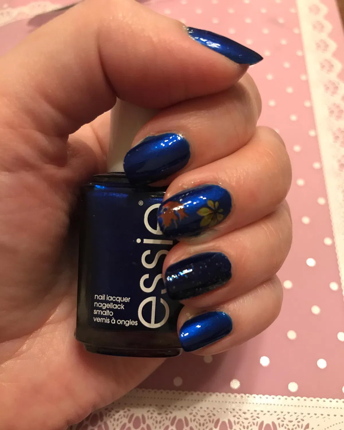 Deep Blue Nails with a Small Leaf Detail