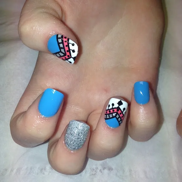 Bright Blue Nails with Silver Glitter and Graphic Accents