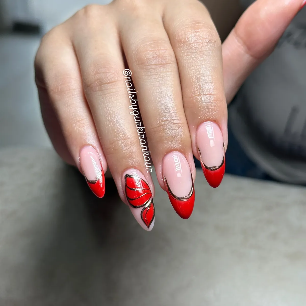 Red French Tips with Metallic Outline and Swirl Accent