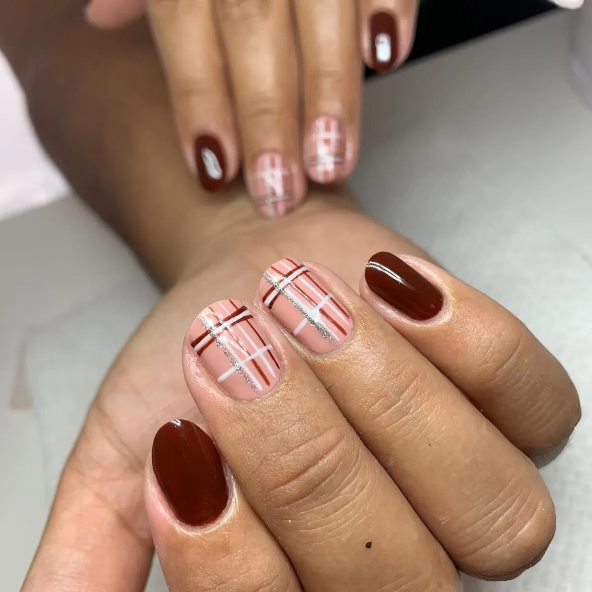 Deep brown solids with pale pink plaid and a diagonal silver stripe