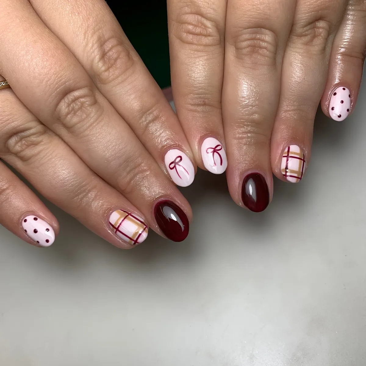 Burgundy plaid mixed with bows and polka-dot accents