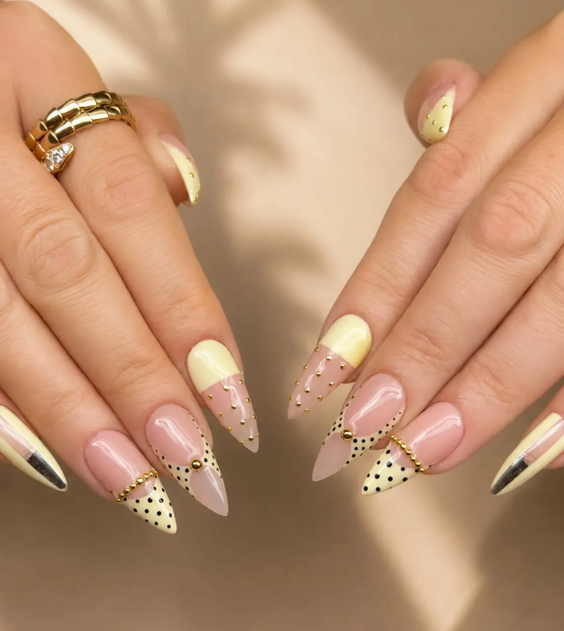 Pointed yellow tips with black dots and gold accents