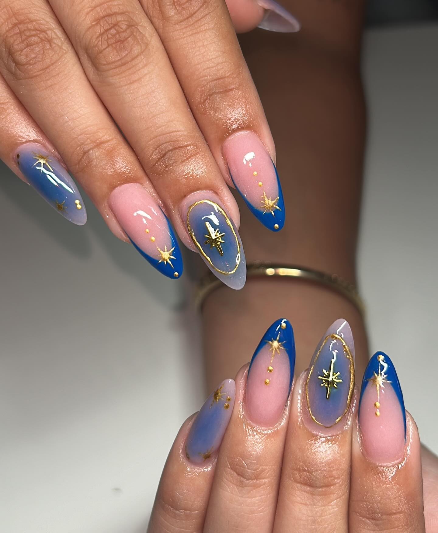 Blue gradient tips with gold starbursts