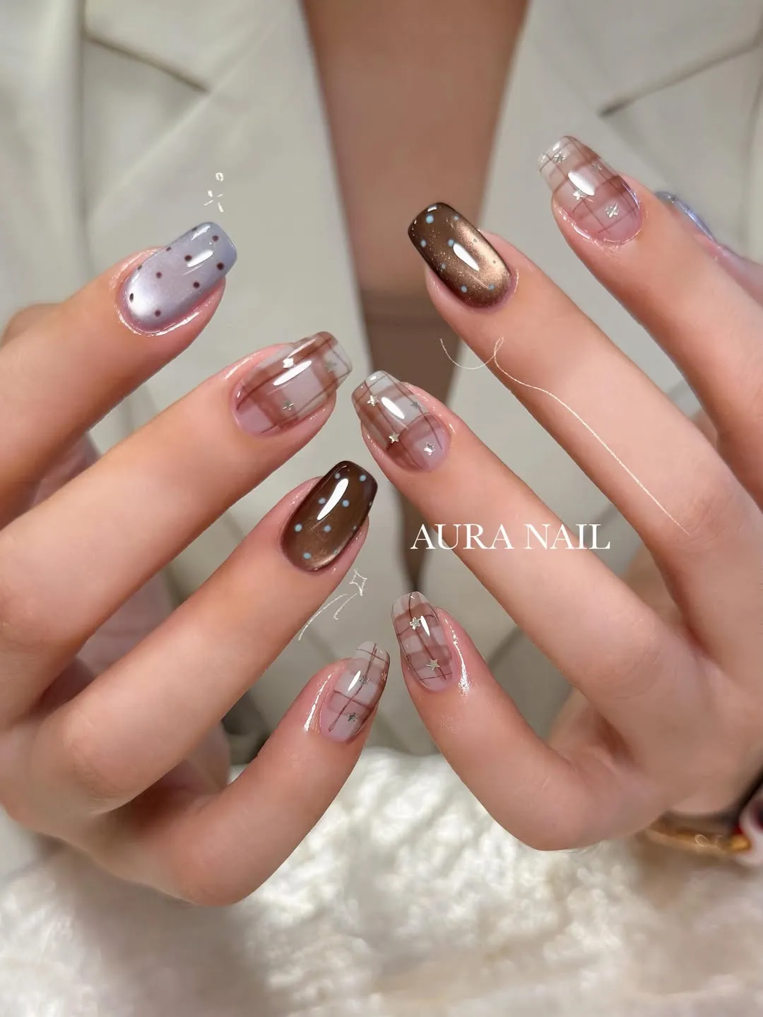 Sheer brown plaid with star accents and dotted feature nails