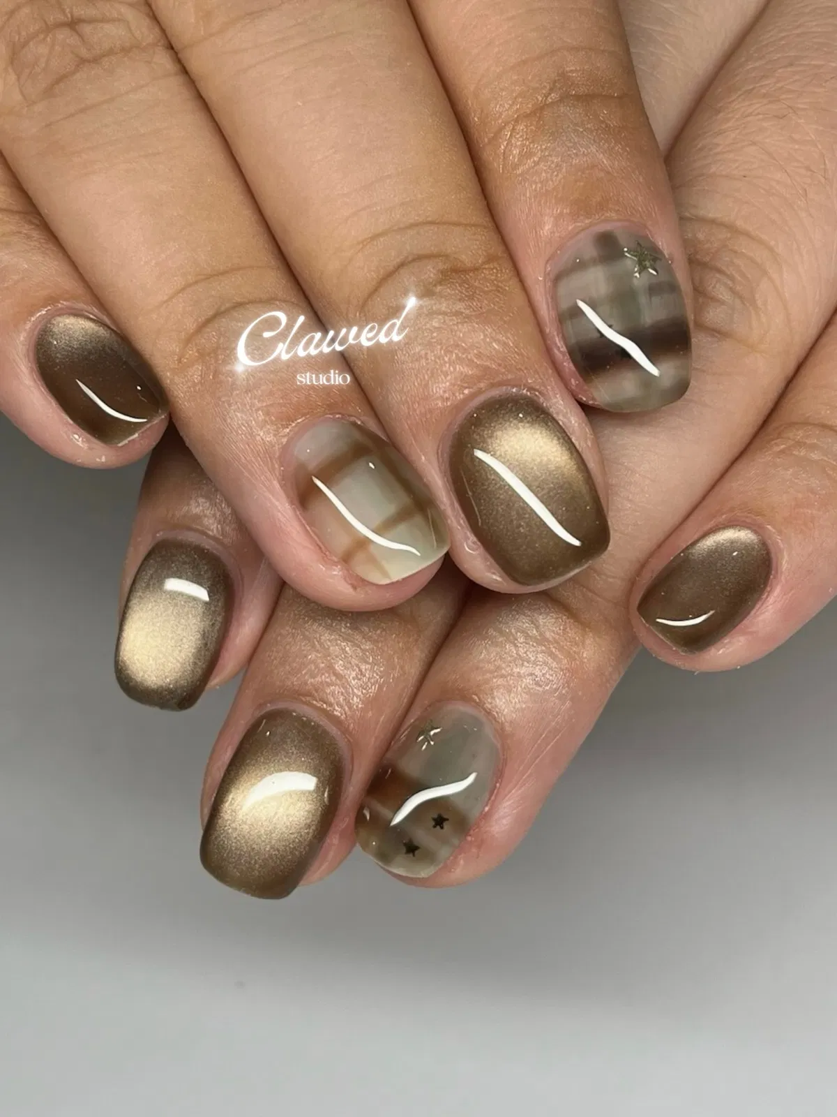 Brown-gold shimmer with muted translucent plaid and star accents