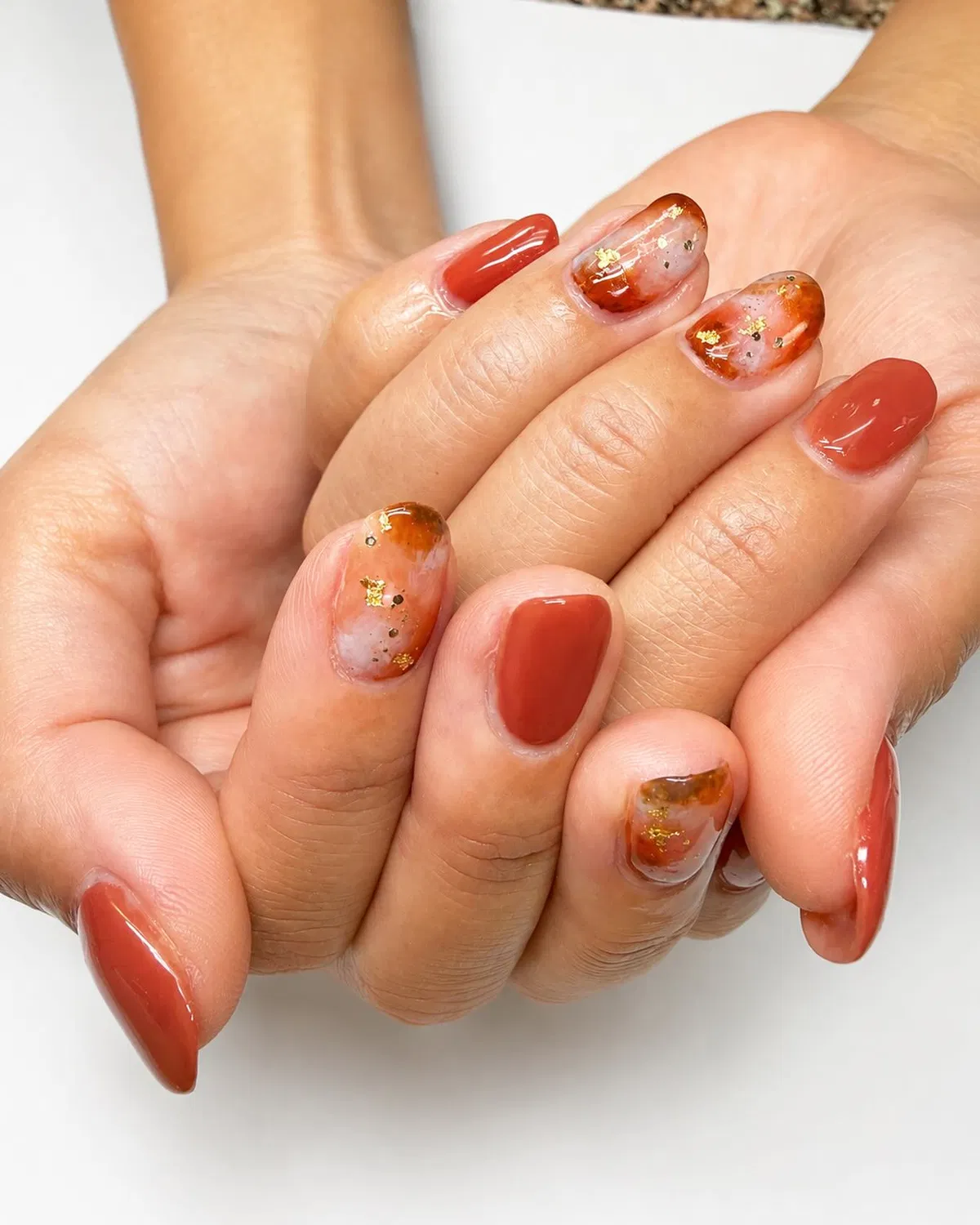 Terracotta solids with marbled gold-fleck accents