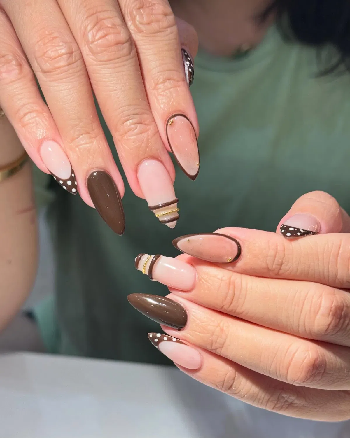 Brown French tips with dots and gold striping