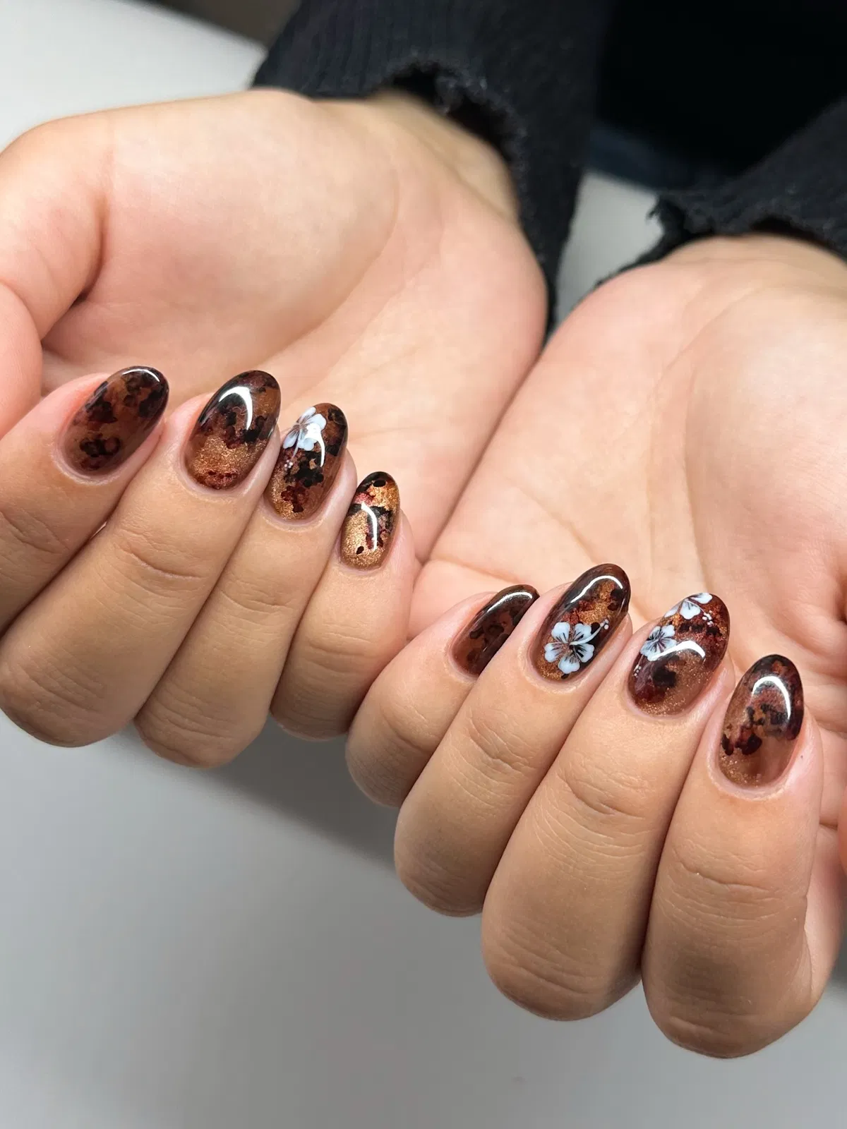 Mottled brown shimmer with white floral accents