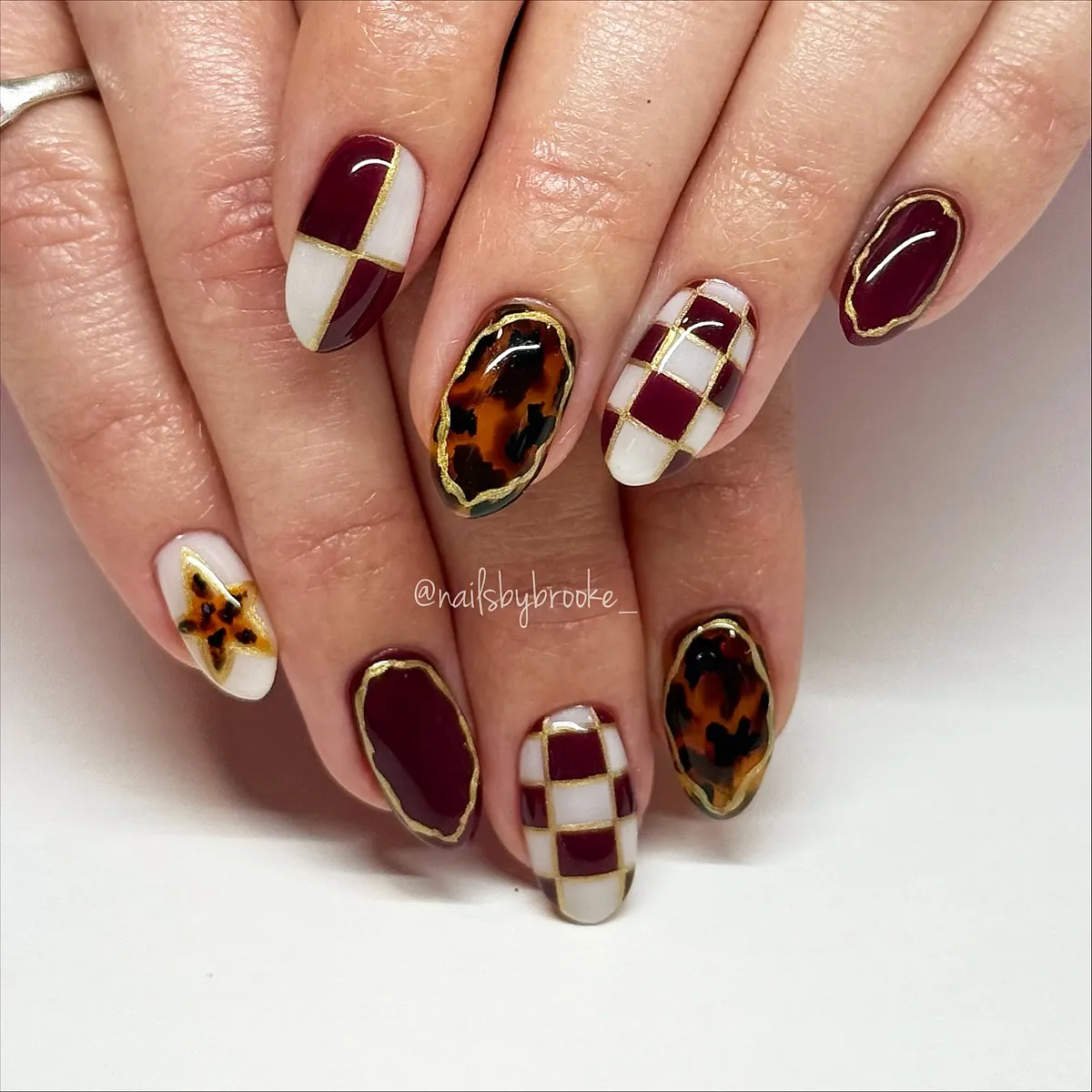 Burgundy grid with gold outlines and tortoiseshell accents