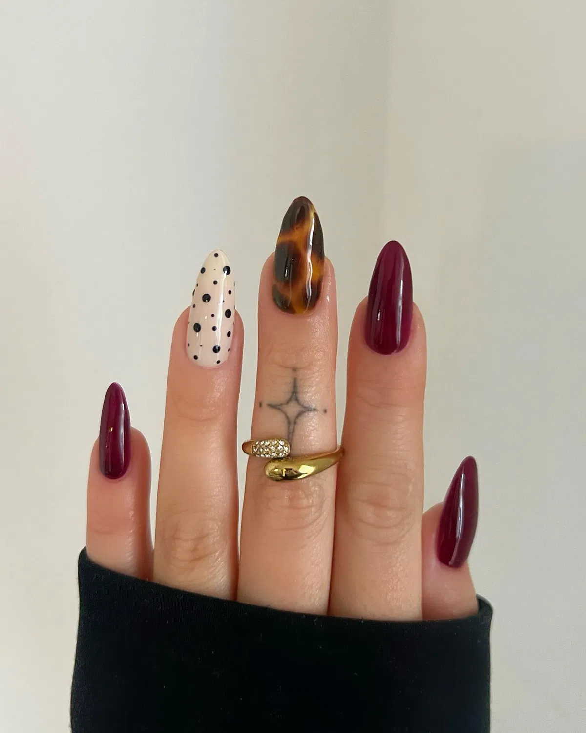 Burgundy set with polka dot and marbled accent nails