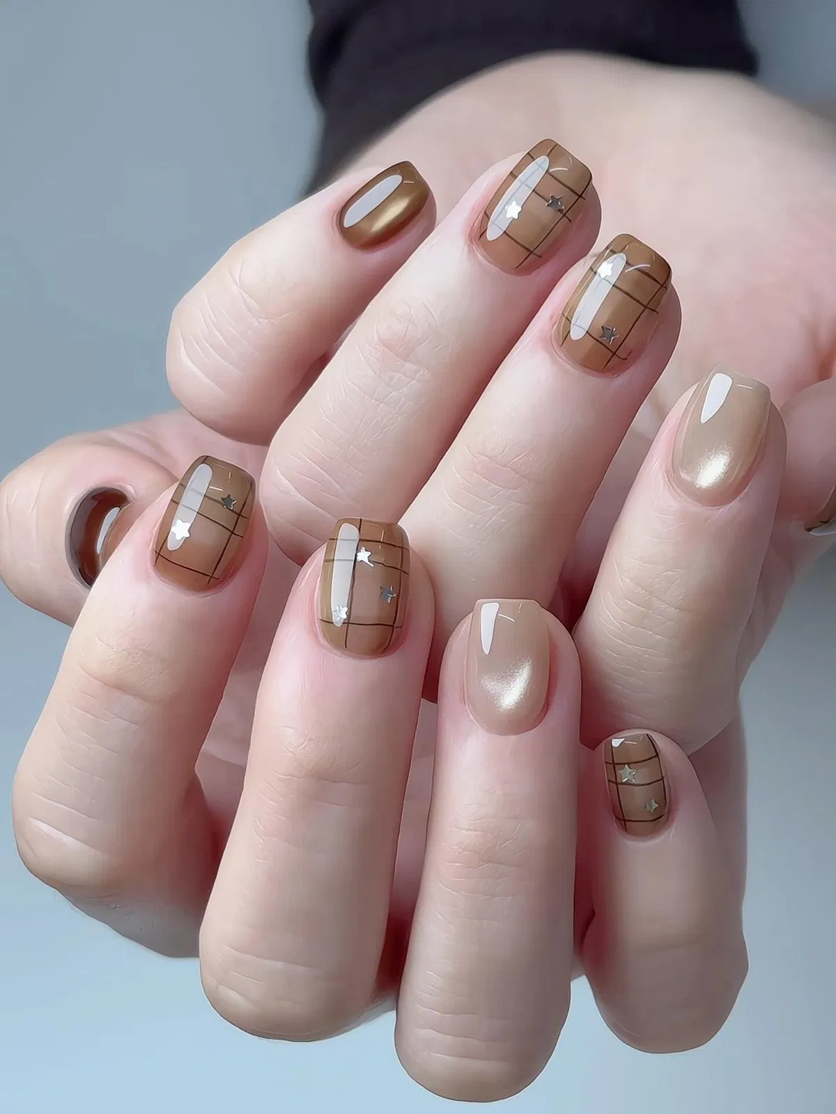 Tan and brown plaid with small star decals