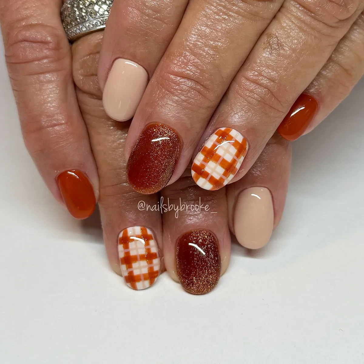 Orange-brown mix with plaid accents