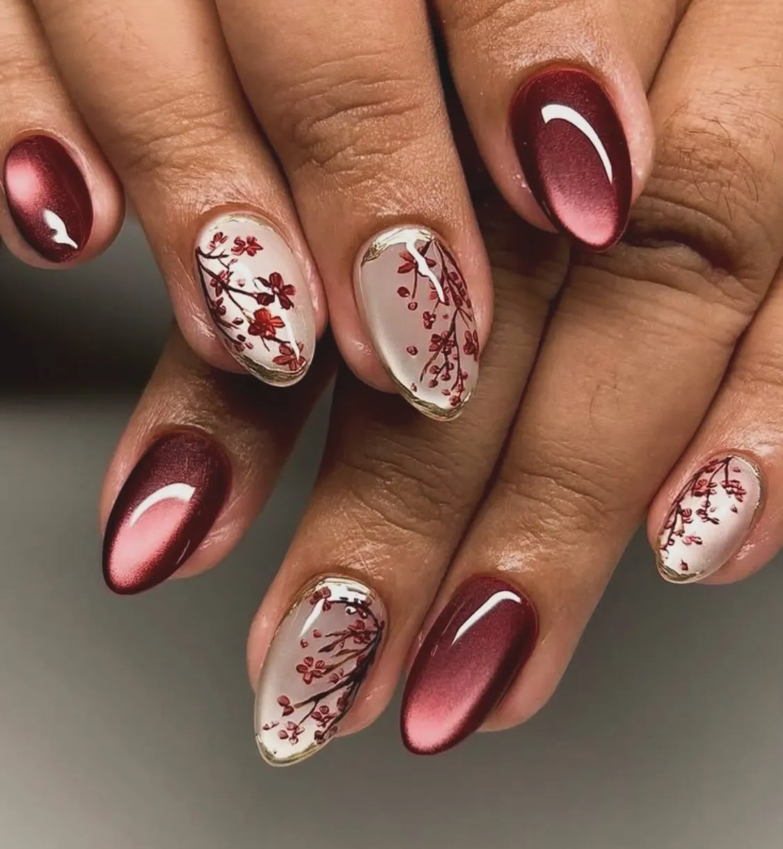 Metallic burgundy with delicate red floral branches