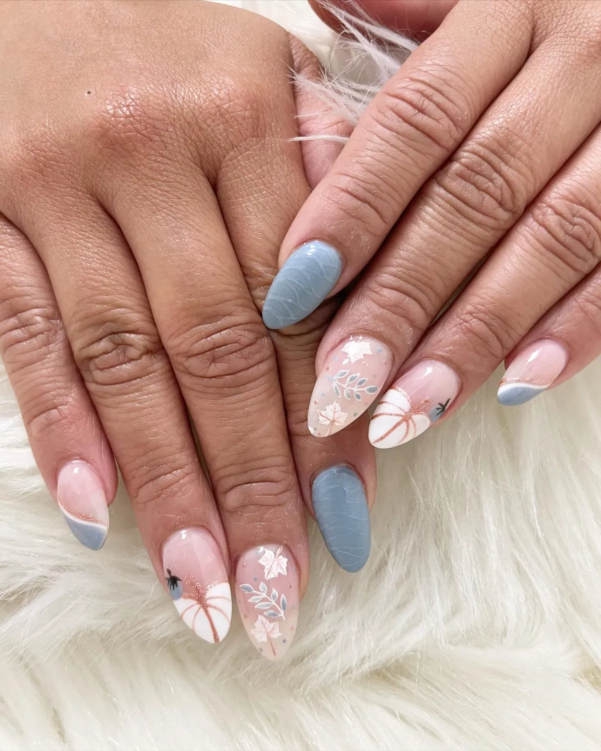 Soft pink and gray-blue mix with pumpkin and leaf accents