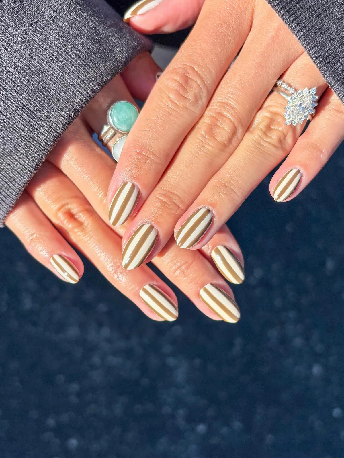 Cream-and-brown vertical striped nails