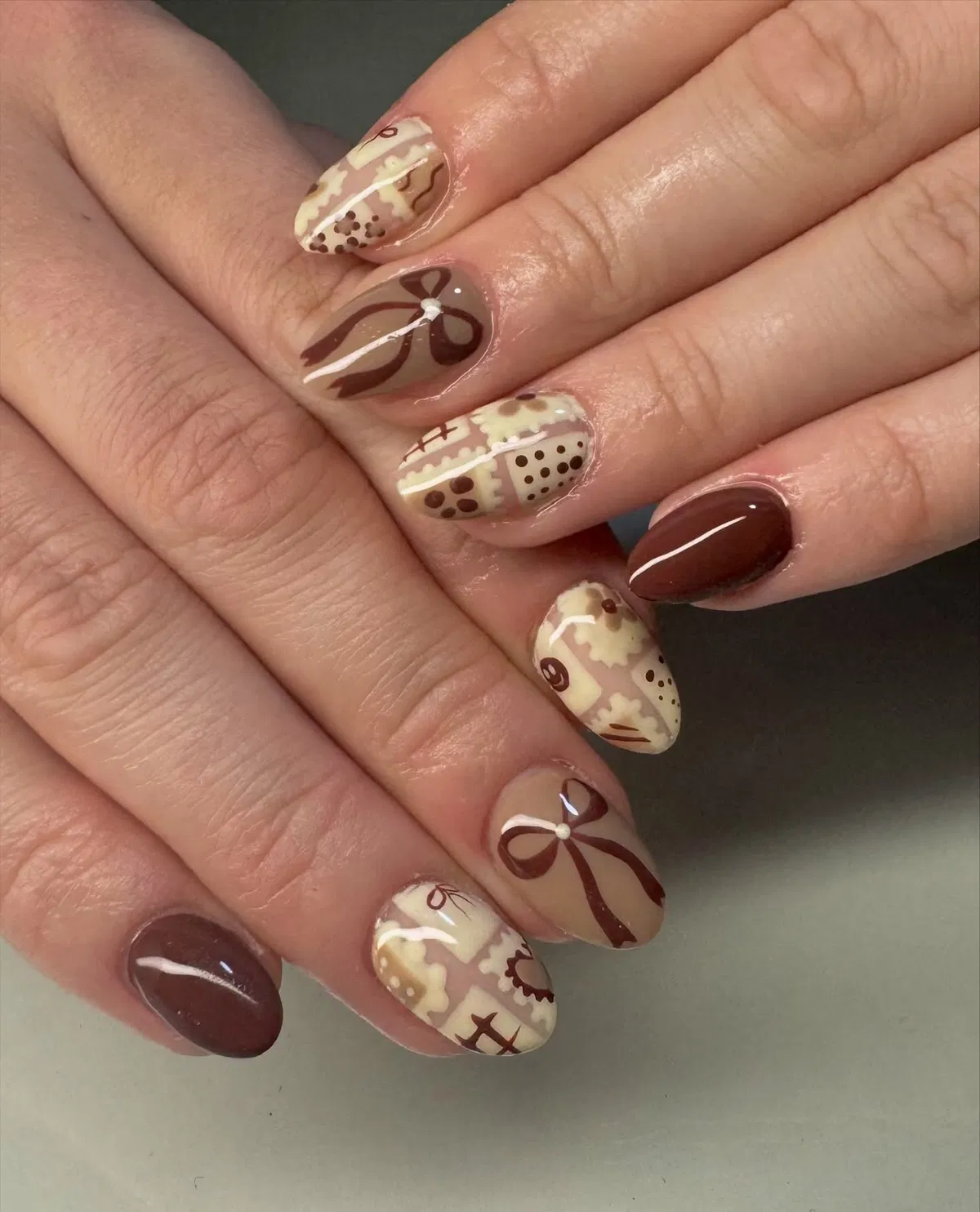 Brown solids with beige patchwork and ribbon motifs