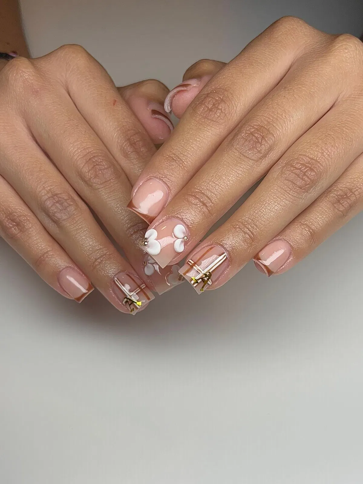 Nude with Brown French Tips, Plaid Striping, and Raised White Flowers
