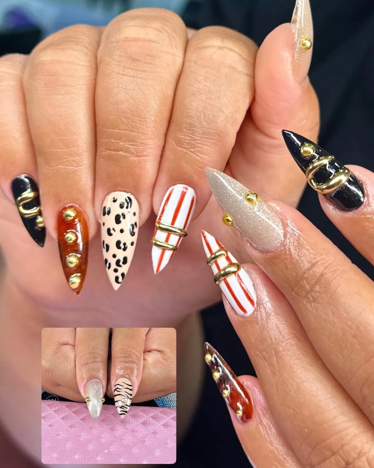 Pointed mix: stripes, spots, black-and-gold hardware accents