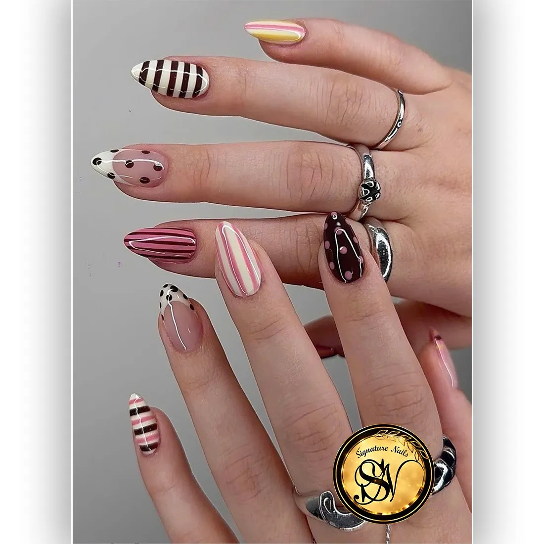 Striped and polka-dot mix with pink, brown, and white