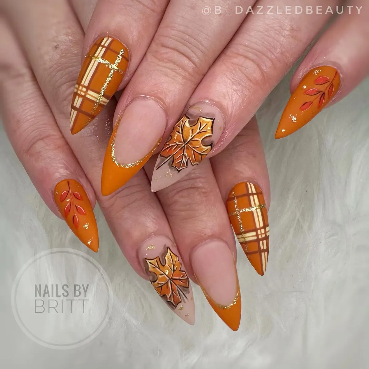 Orange plaid accents with gold glitter lines and leaf art