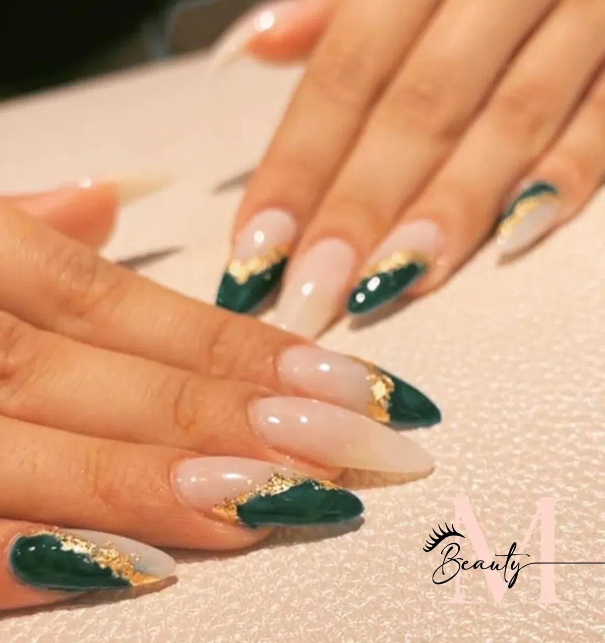 Dark green tips with gold foil accents on nude base