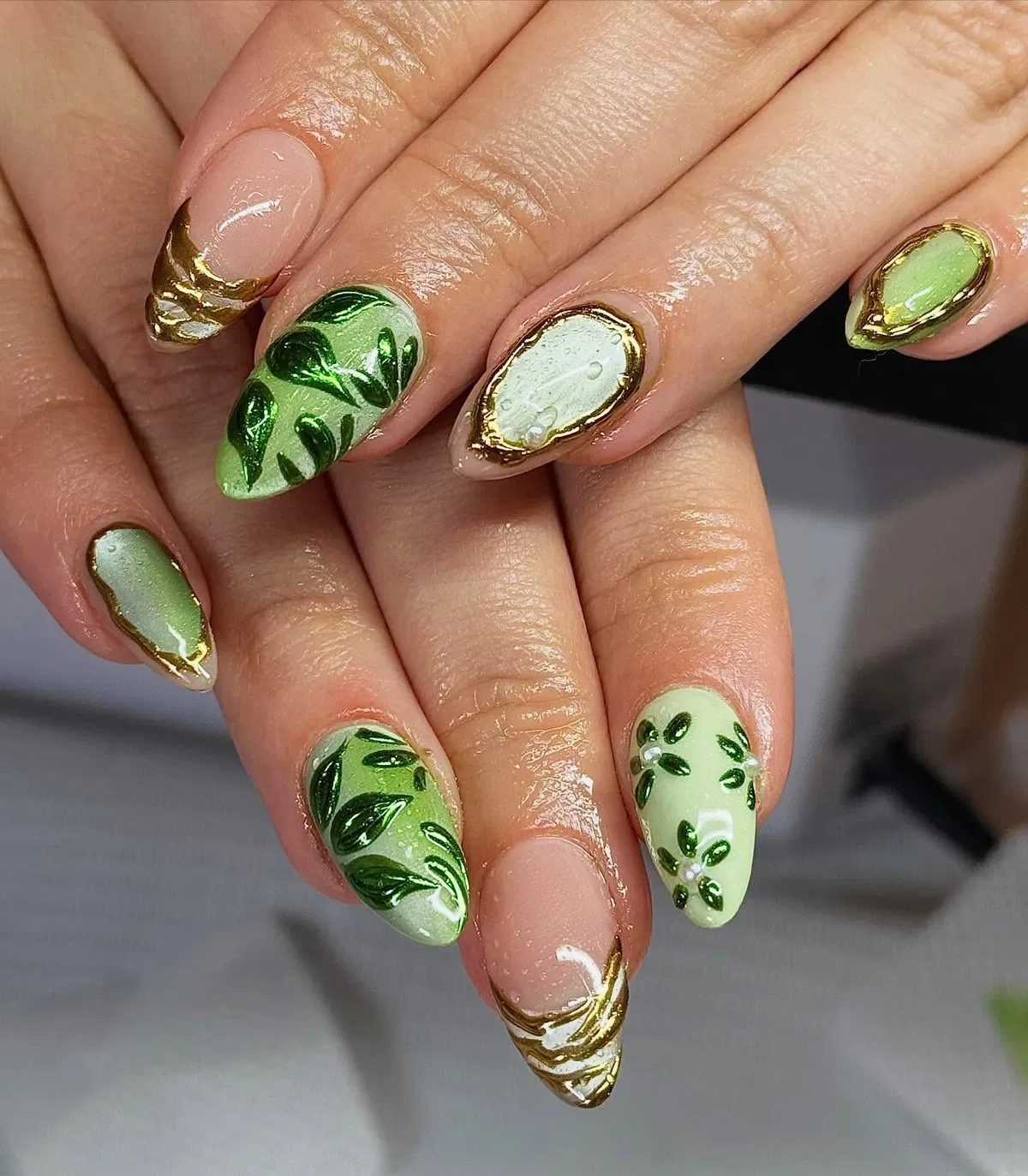 Leafy green motifs with gold edging and mixed nude accents