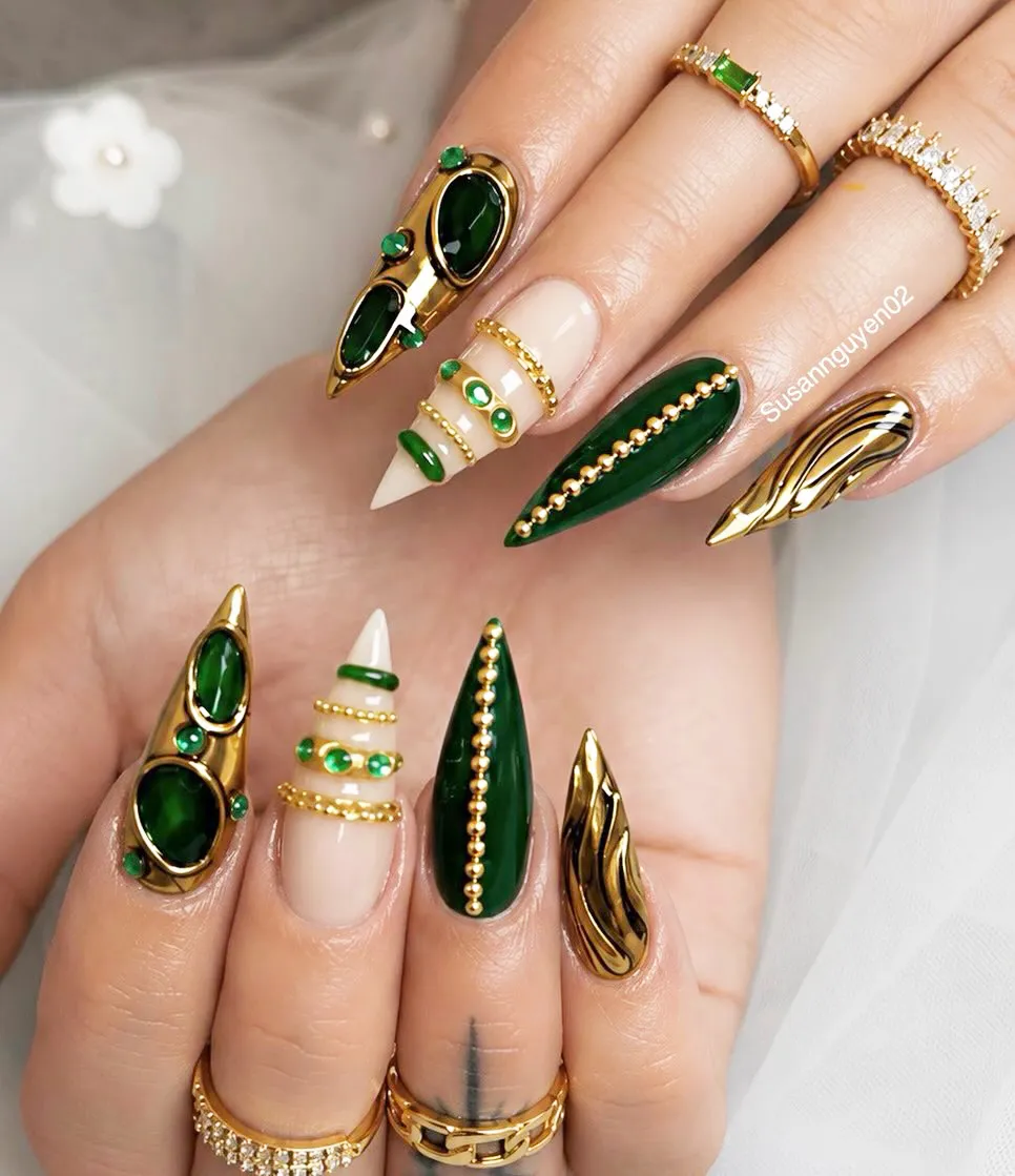 Dark green and gold statement nails with bead rows and raised settings