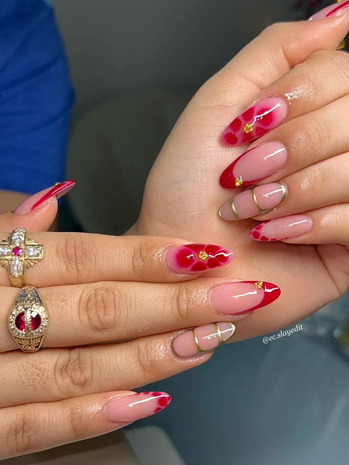 Nude base with red tips, red blotches, and thin gold striping