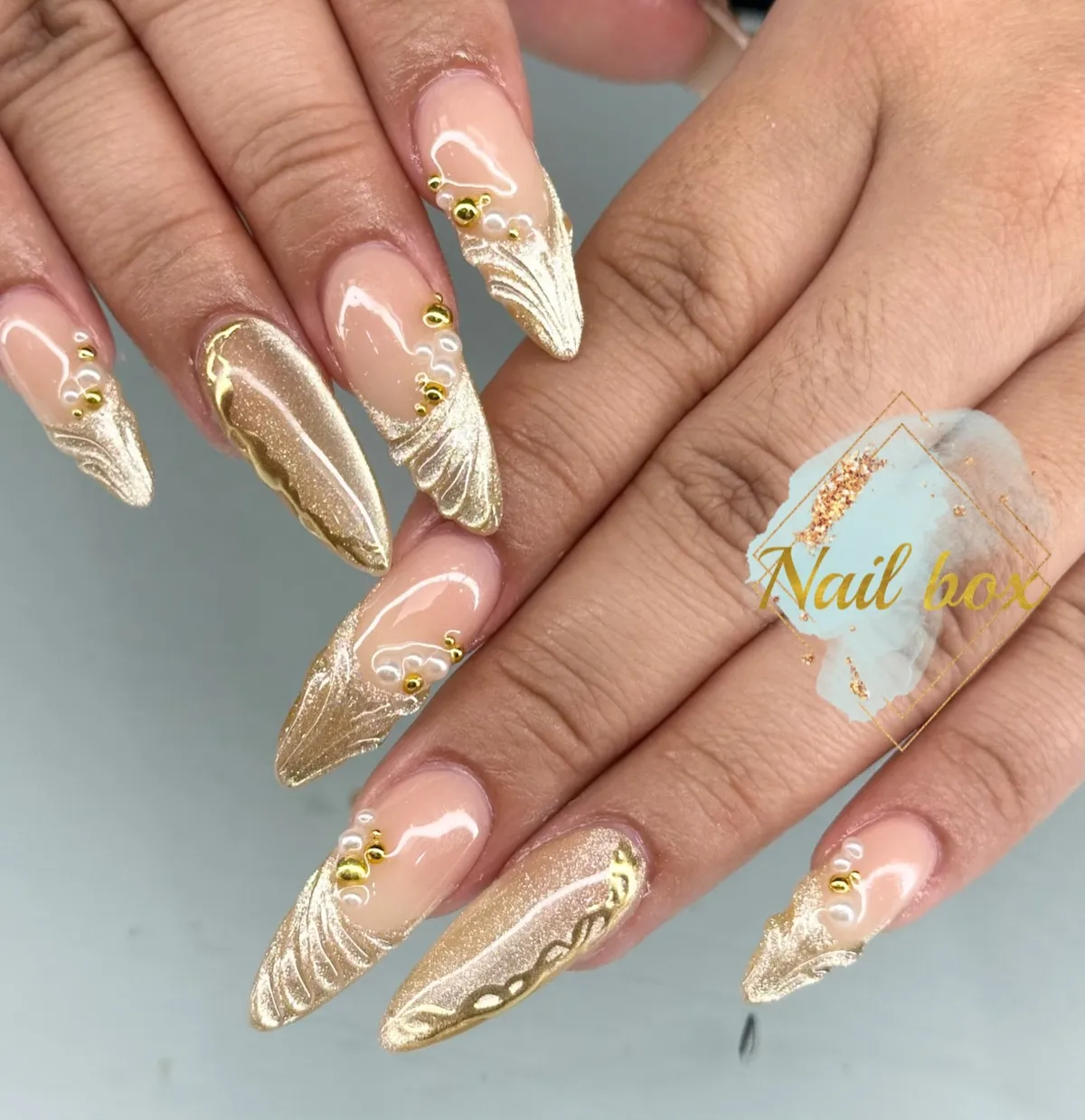 Nude base with sculpted gold tips and gold studs
