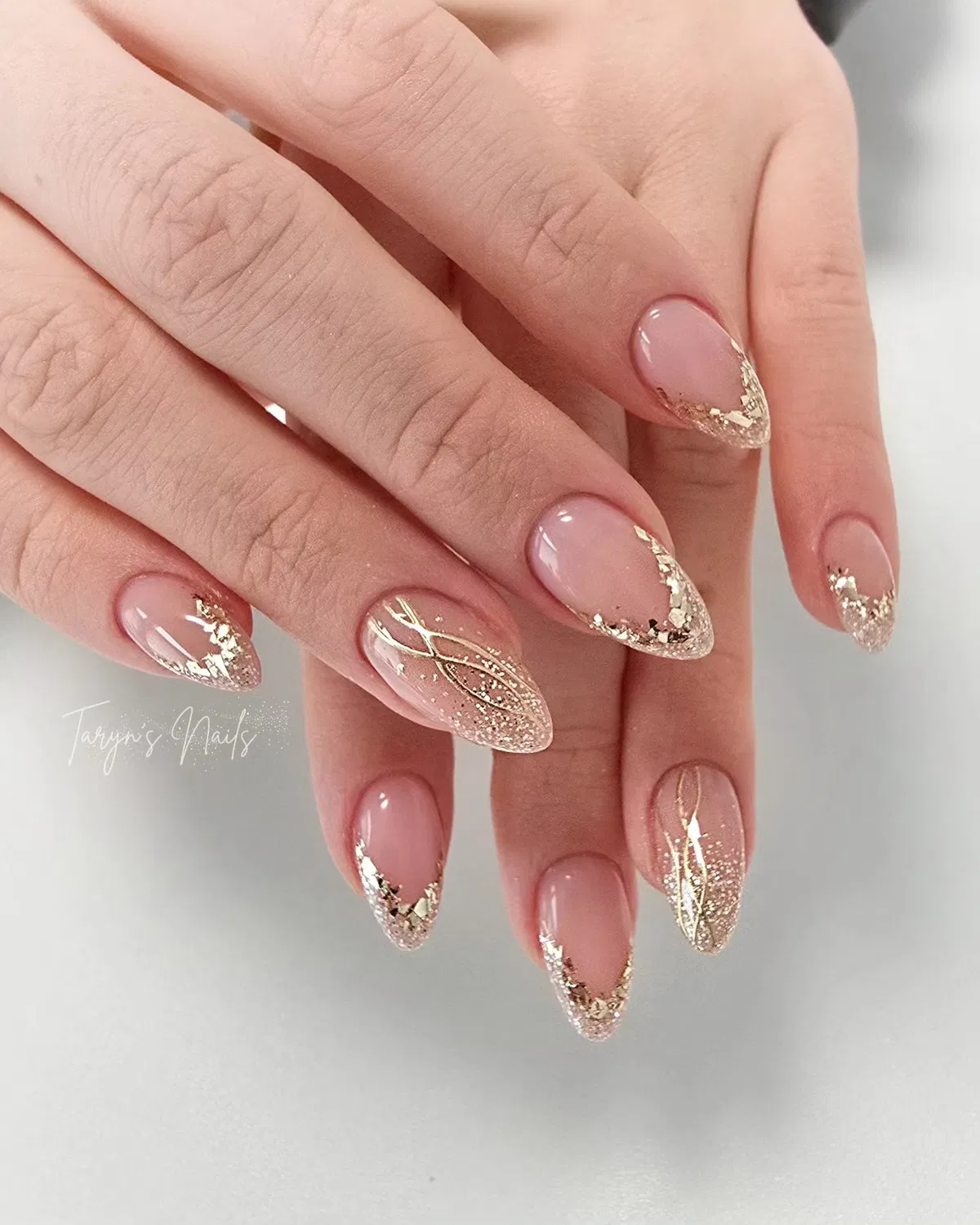 Gold glitter ombré with foil-tipped edges and fine gold linework