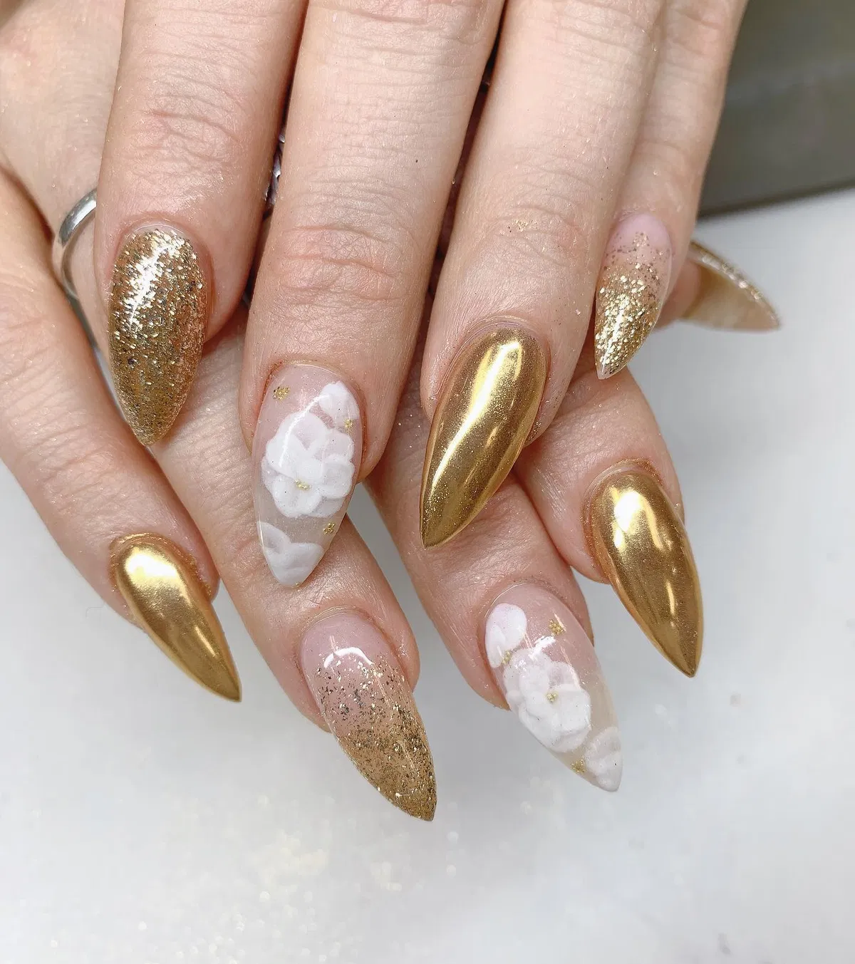 Gold chrome and glitter mix with white floral accents