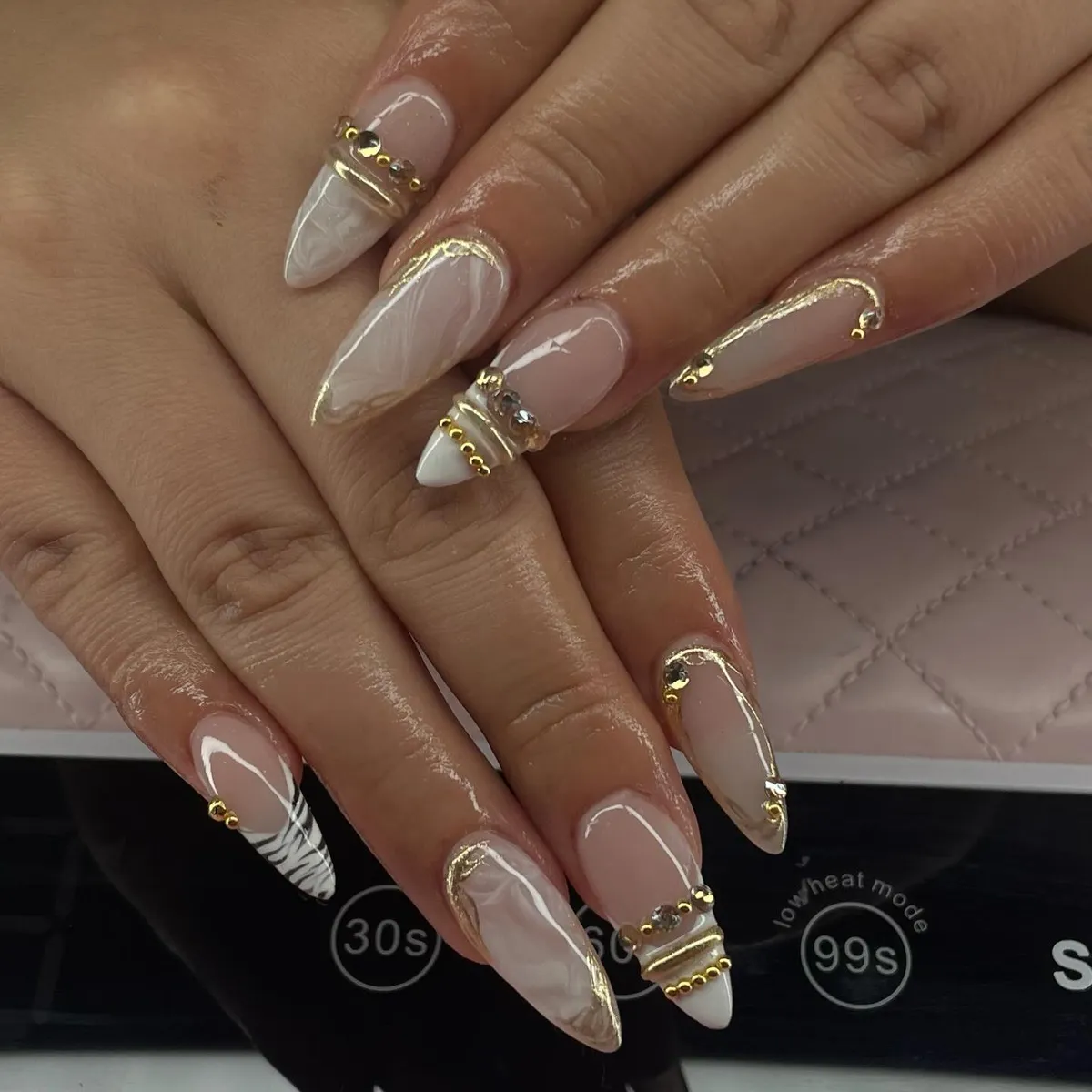 Gold-outlined marble with studded accents