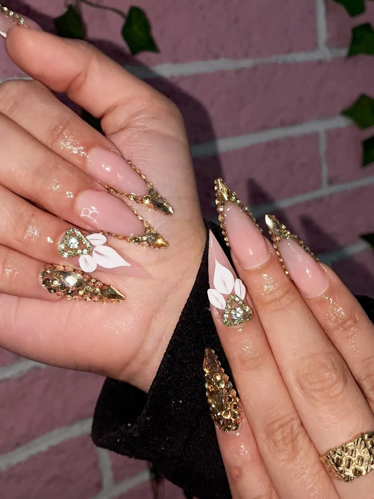 Maximal rhinestone-edged nails with triangular gem accents