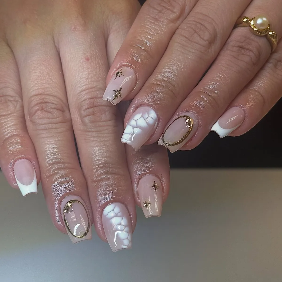 Square Nude Nails with White Tips, Gold Frames, and Star Studs