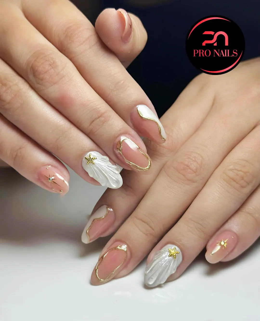 Gold outlines with white 3D shell accents and gold starfish