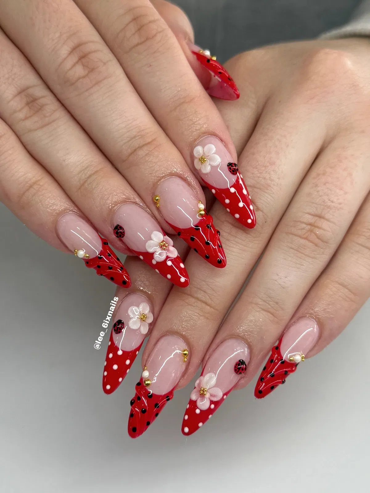 Red tips with ladybugs, dots, and 3D white flowers