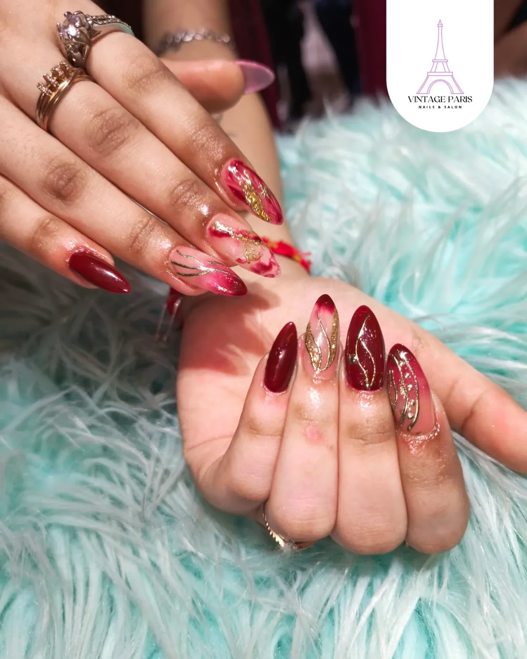 Deep red almonds with gold glitter and fine gold line accents
