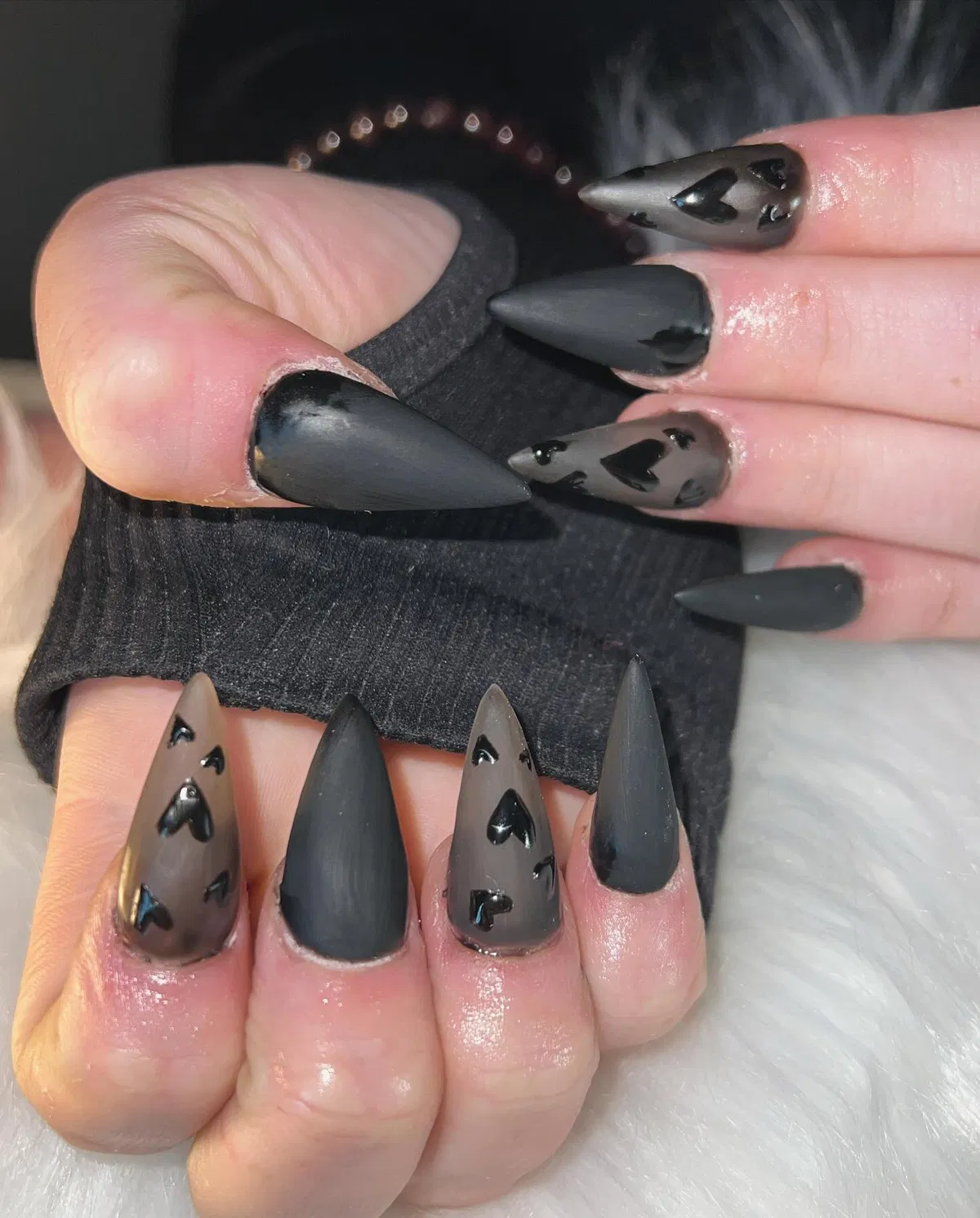 Matte stiletto set with raised black hearts on translucent gray