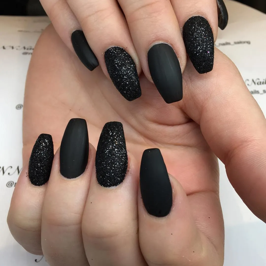 Matte black coffin nails with textured sparkle accents