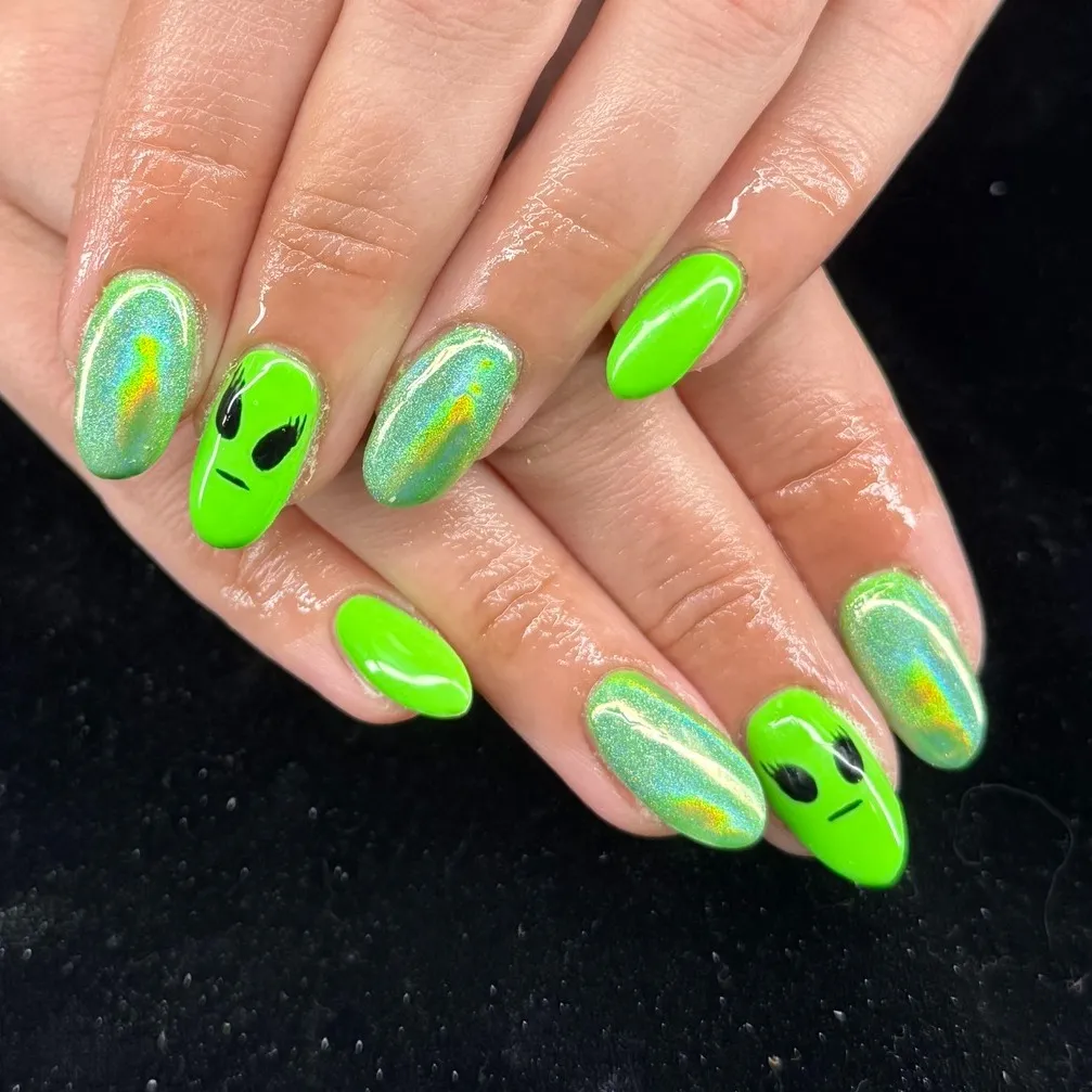 Neon green with alien-face accents and iridescent nails