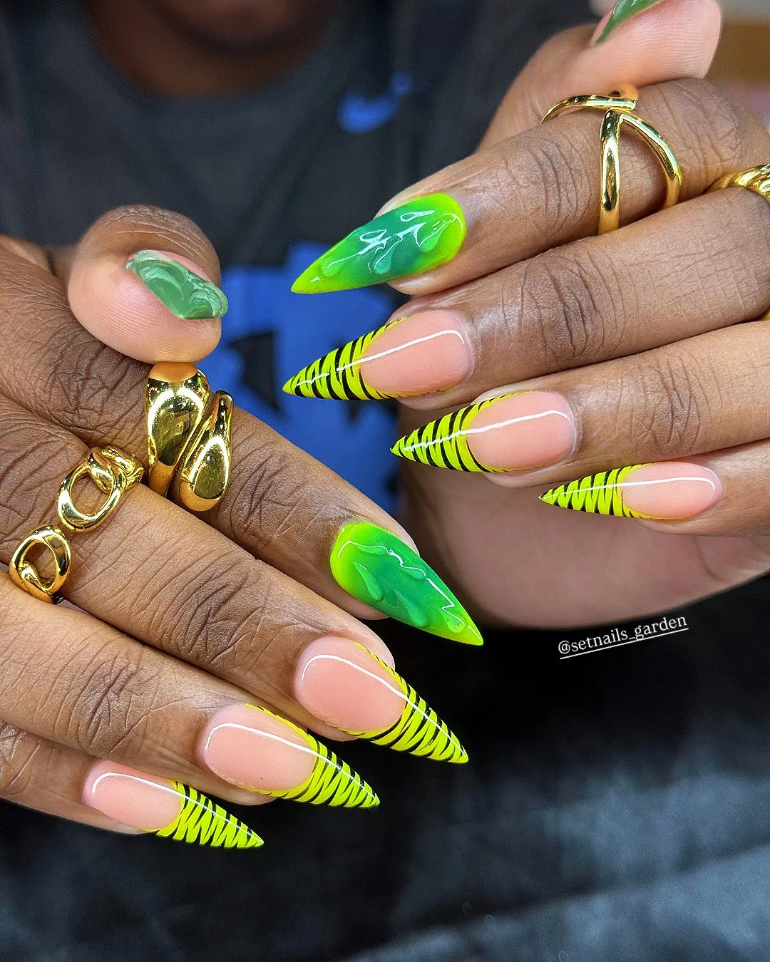 Stiletto neon tips with black striping