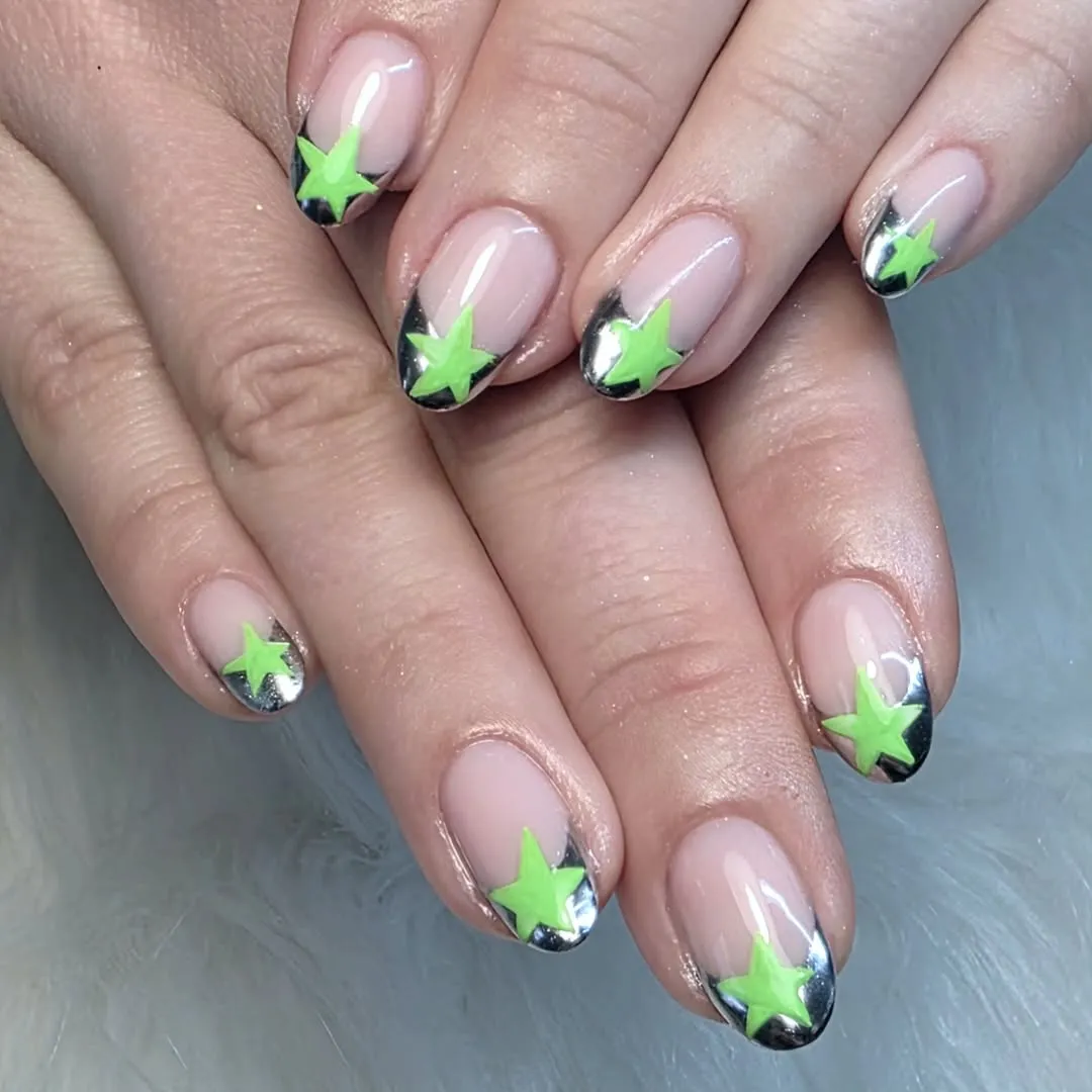 Neon green stars over metallic silver French tips