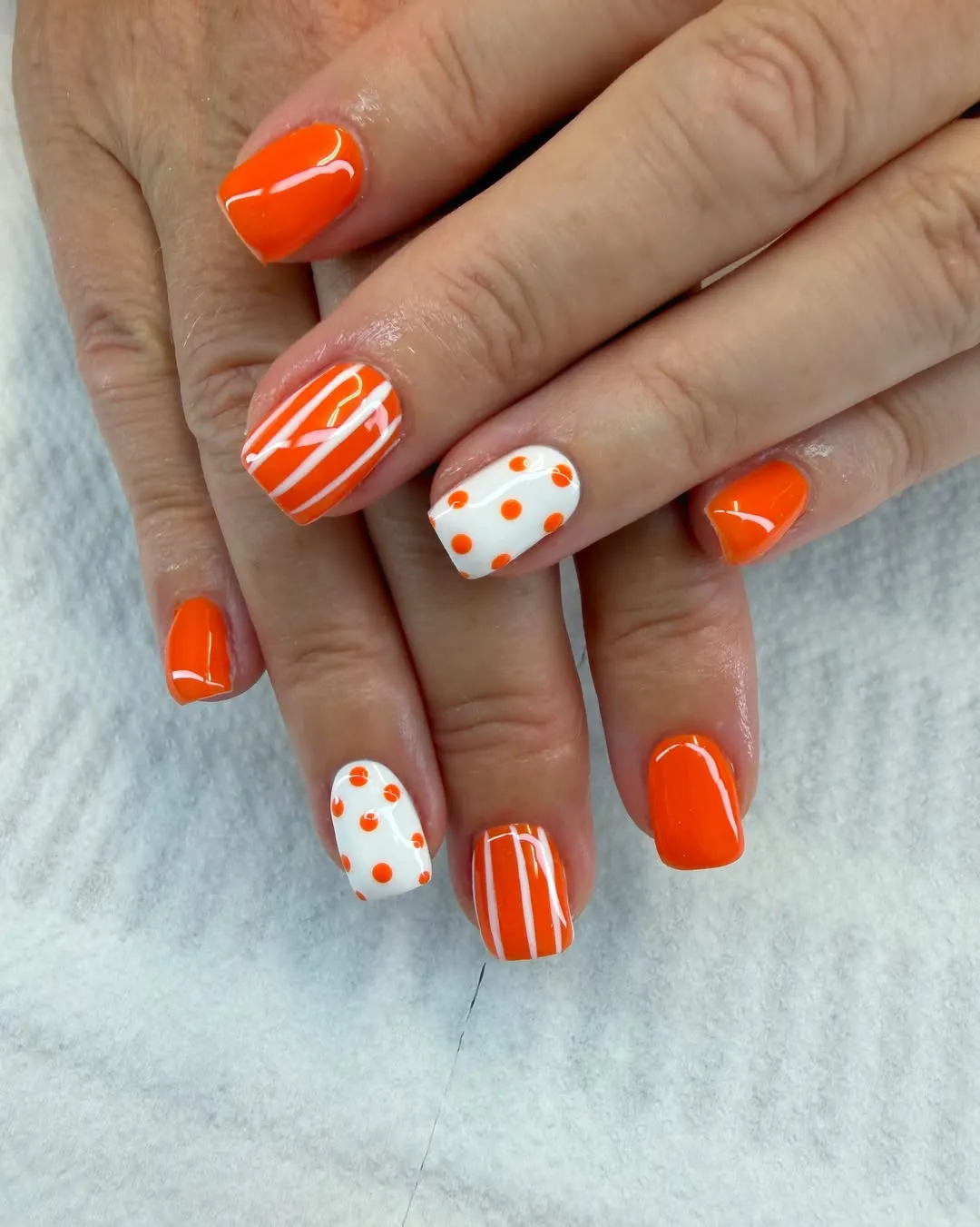 Bright orange with striped and polka-dot accents