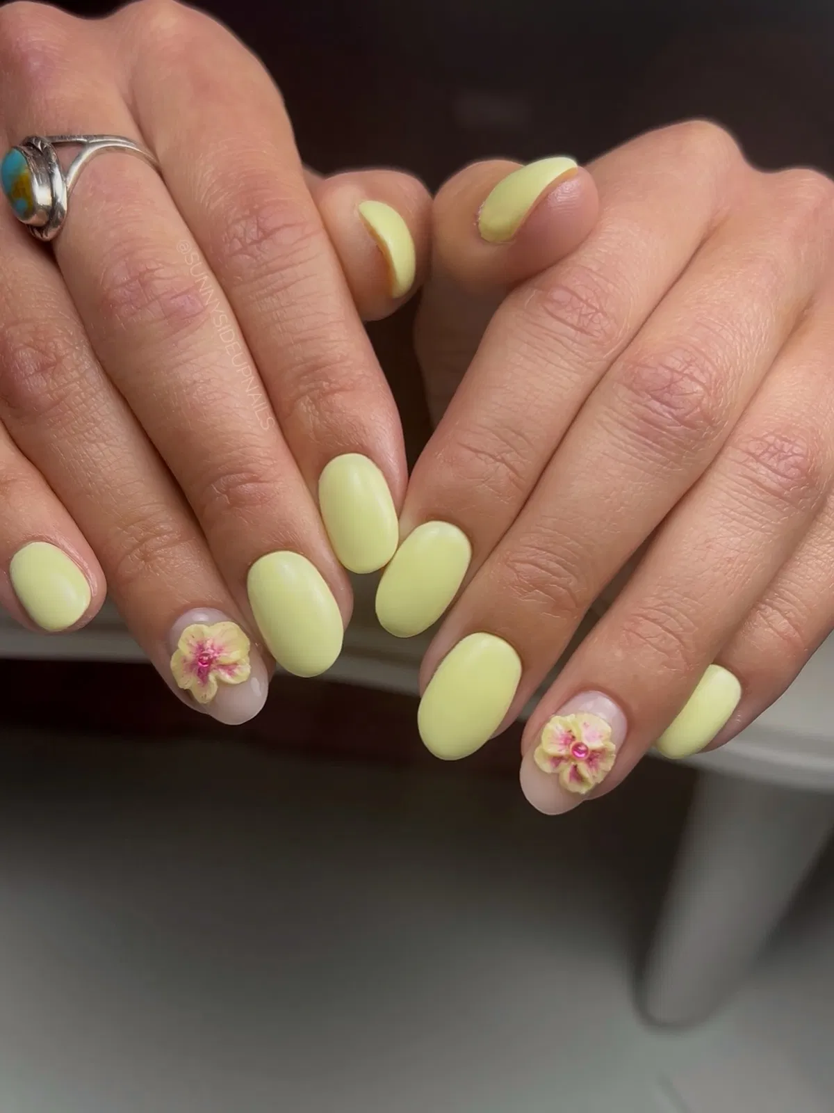 Matte pastel yellow with 3D floral accents