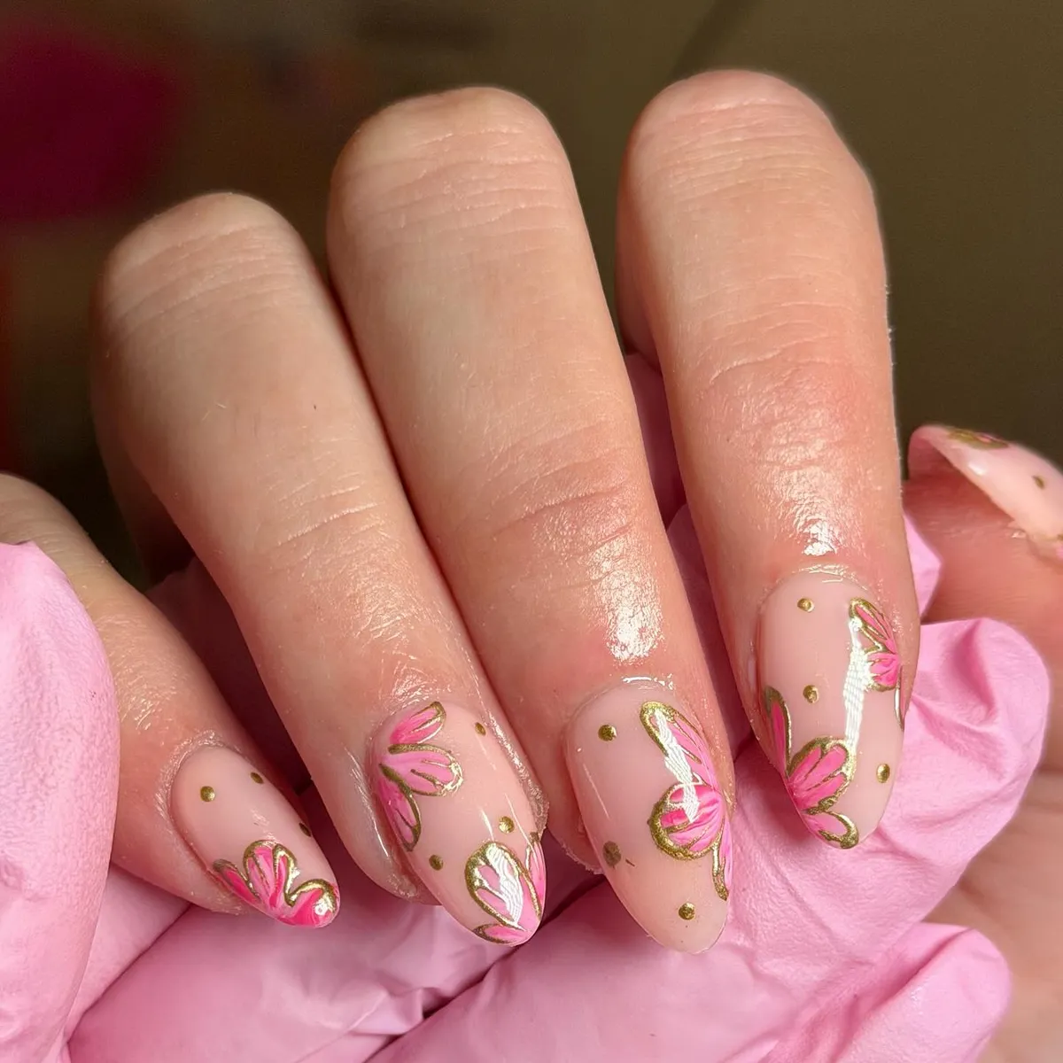 Gold-outlined pink petal motifs with dotted accents
