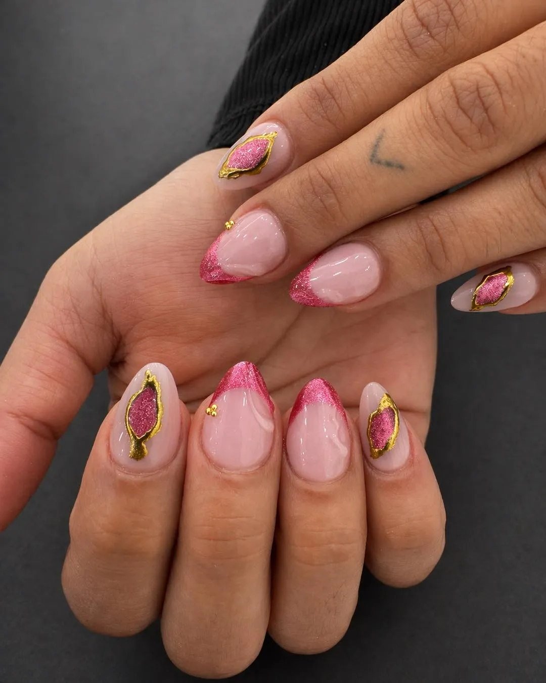 Pink glitter tips with gold framed accent shapes